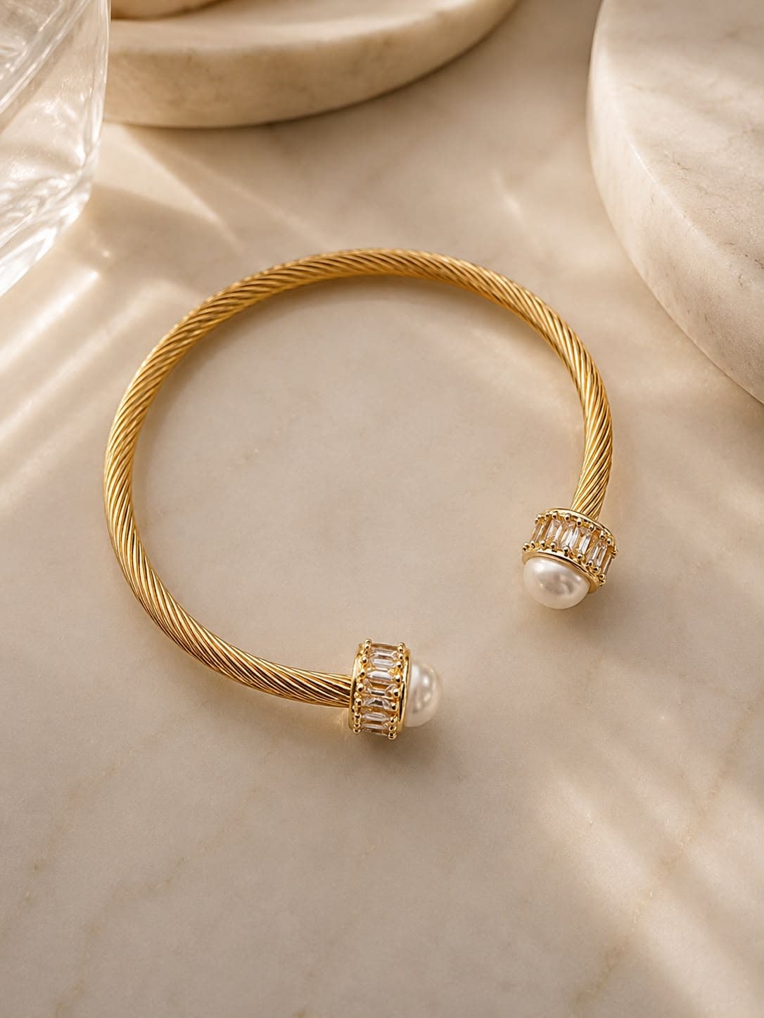 Sylvie gold cable cuff with pearl and crystal caps